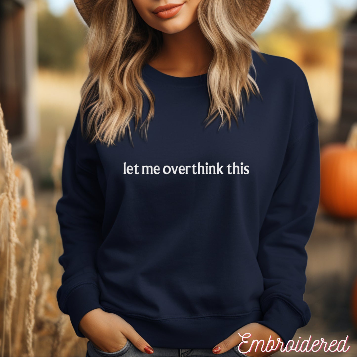Navy blue fleece lined crewneck with the words let me overthink this embroidered on the front.