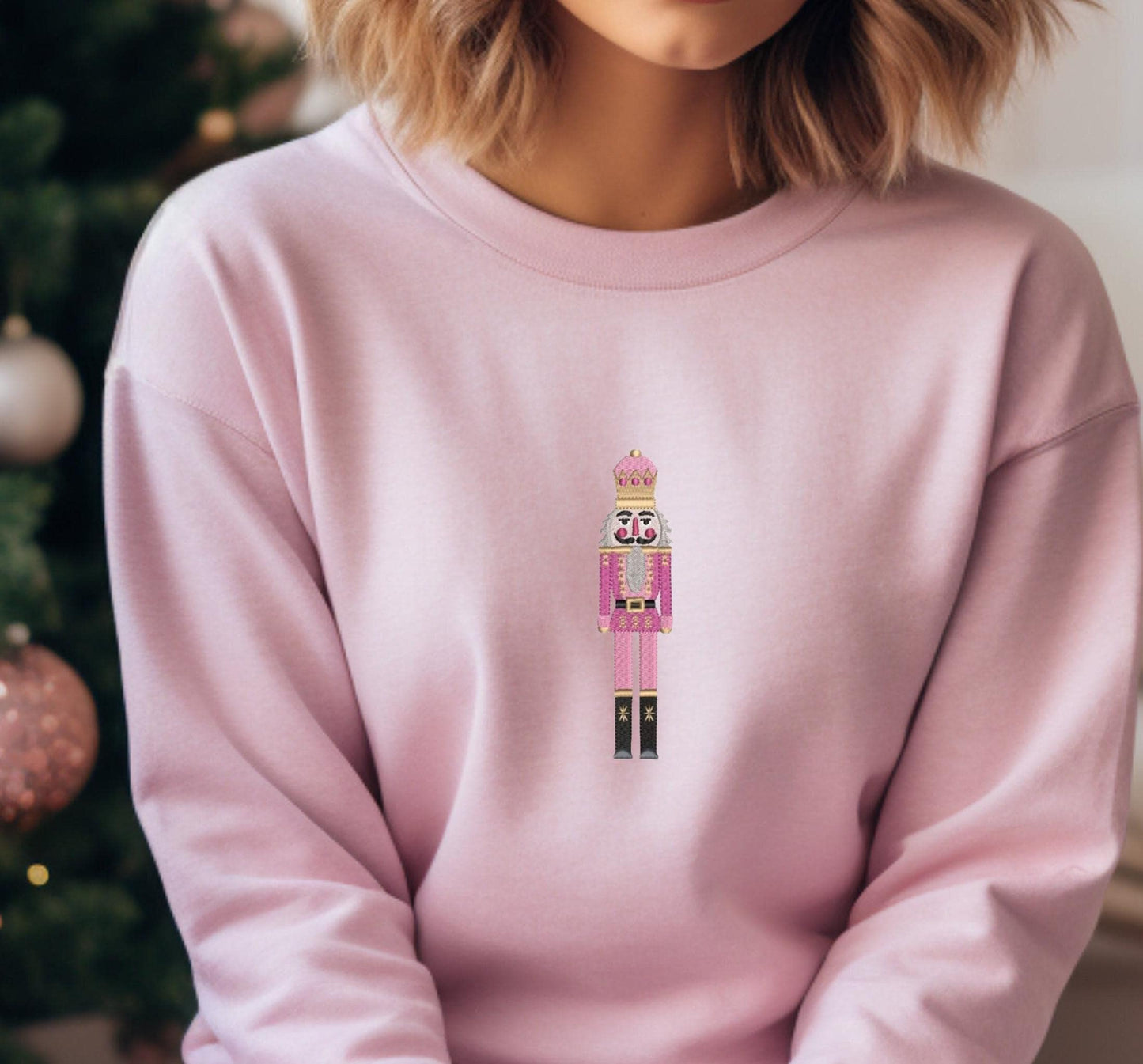 Pink Crewneck Cozy Fleece Sweatshirt embroidered with a cute pink Nutcracker on the front.