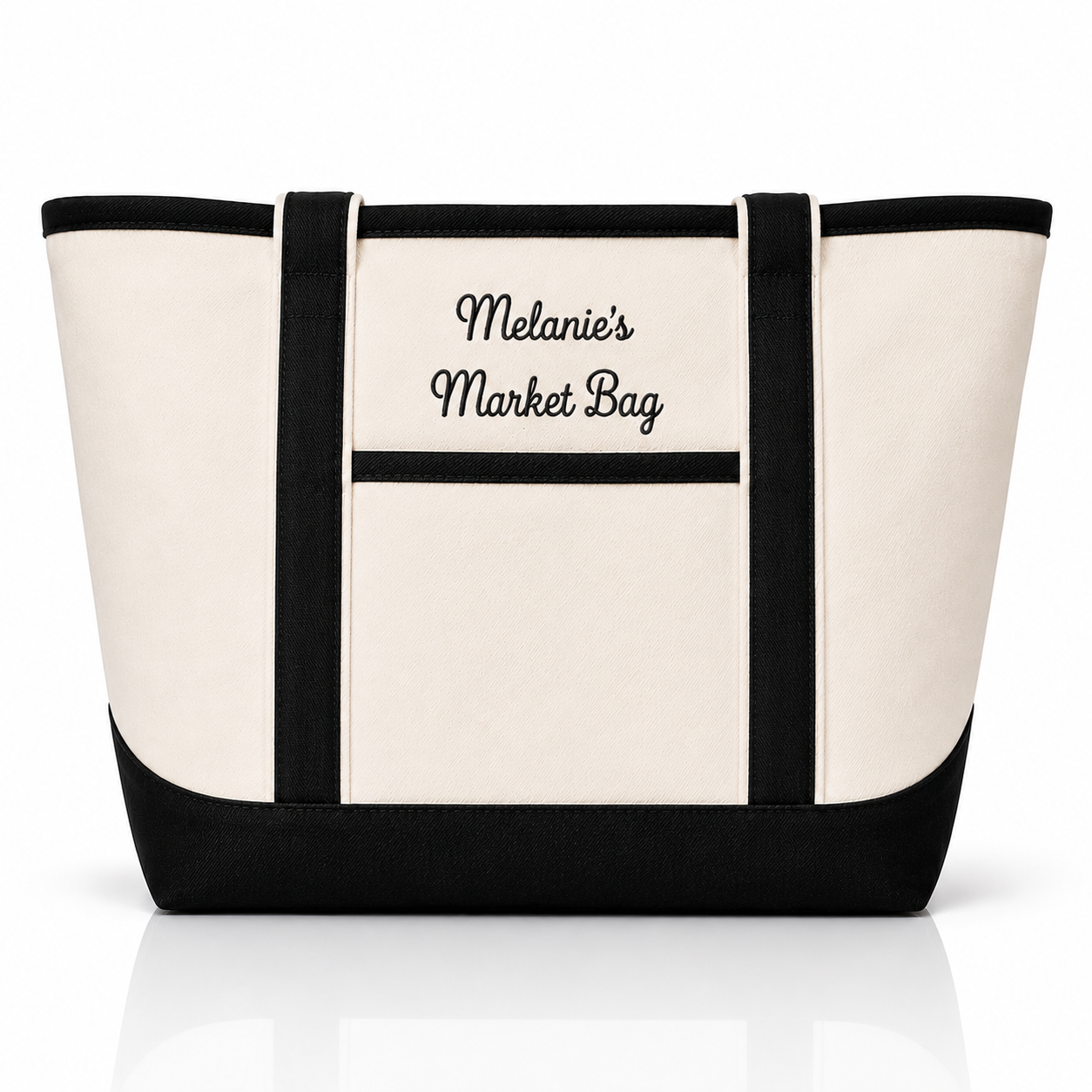 An off-white canvas tote bag with black trim, black handles, and a black bottom panel. The front features a pocket with the text 'Melanie's Market Bag' printed in black script and serif fonts, set against a clean white background with a subtle reflection.