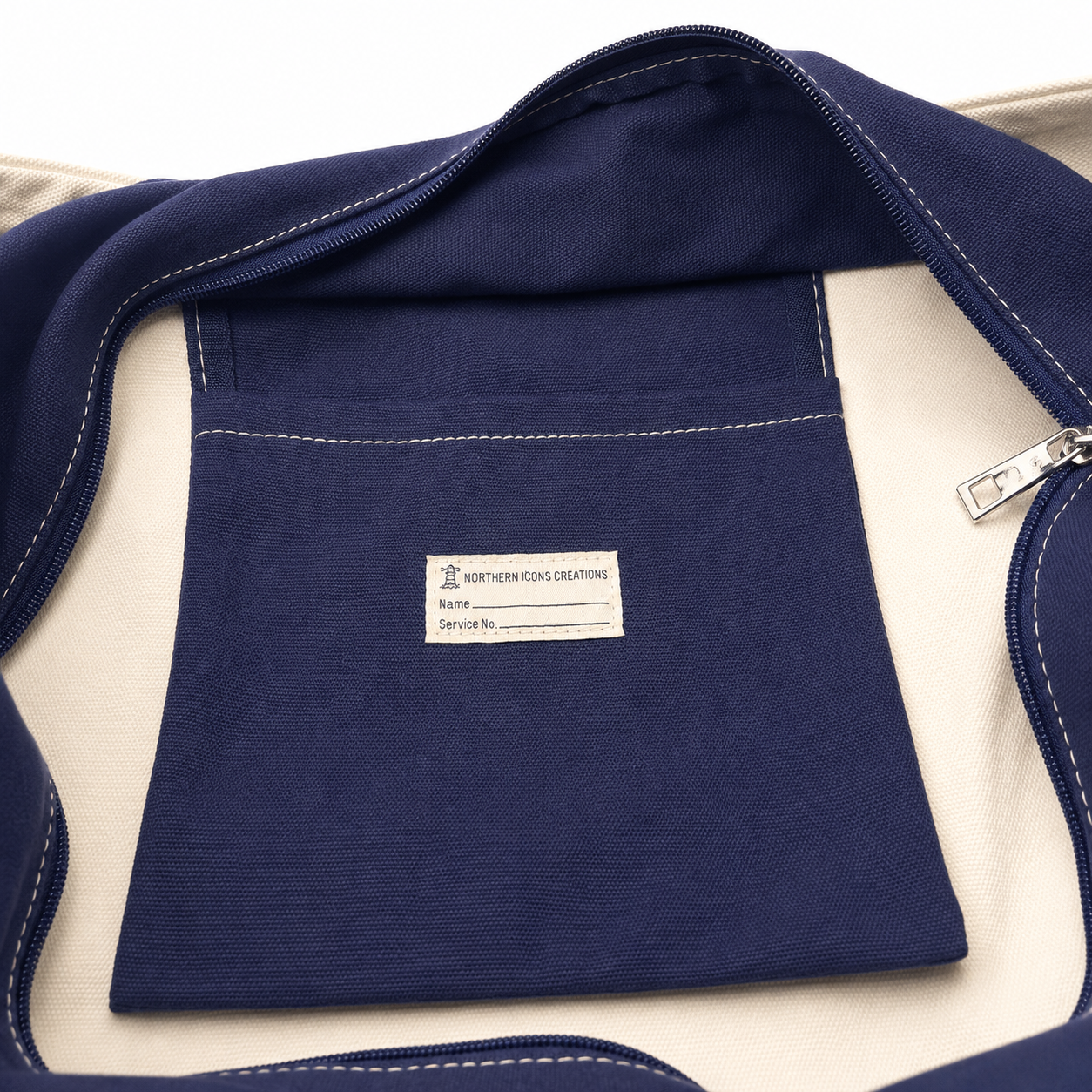 Overview view of the snoboard tote's navy interior and zippered storage pocket