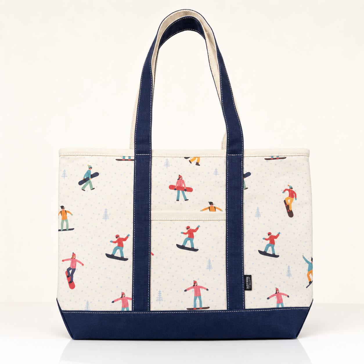 White Canvas Snowboard tote bag with navy handles and colorful winter print