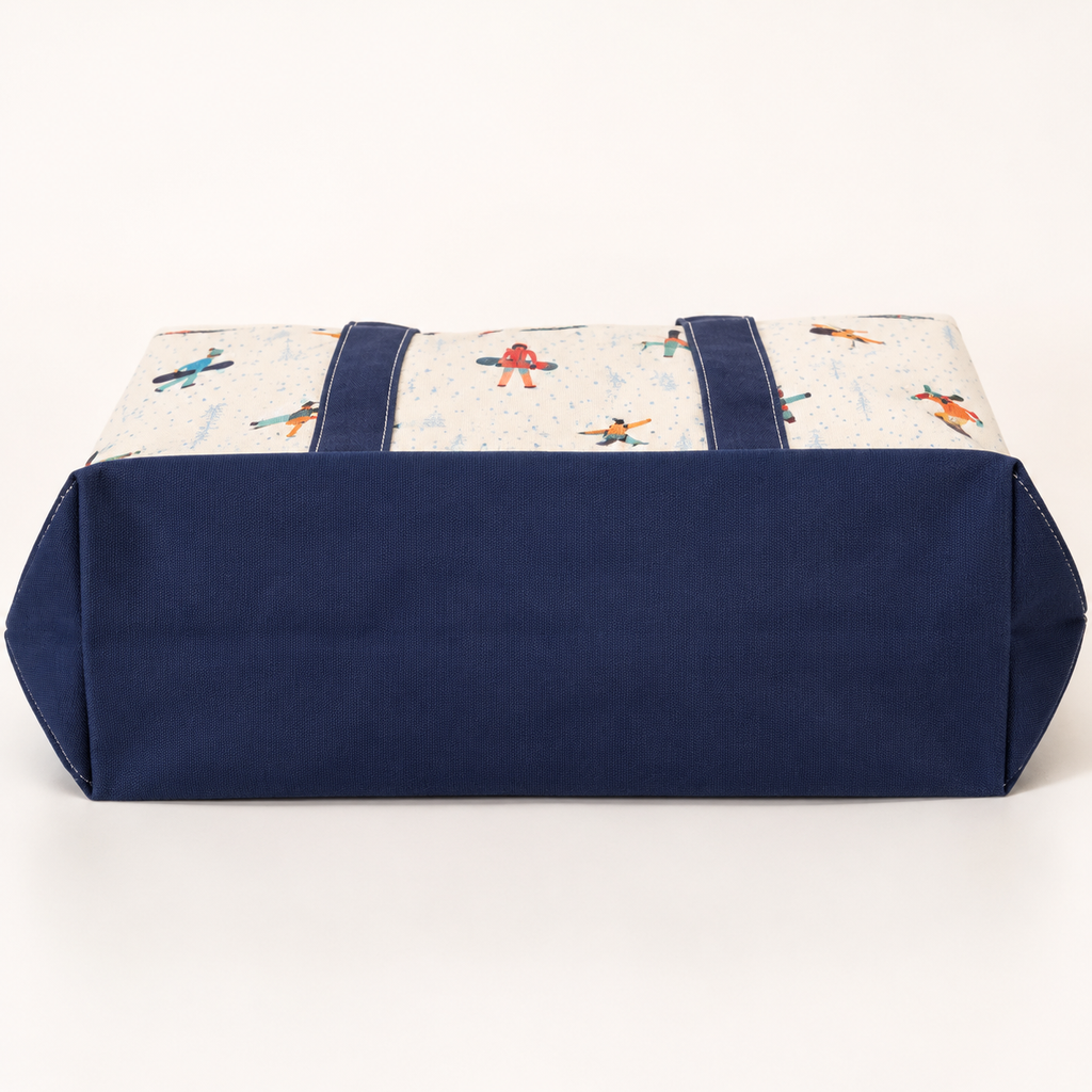 Reinforced navy bottom gusset on white snowboard canvas tote bag