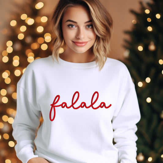 White embroidered sweatshirt with the word &quot;Falala&quot;.