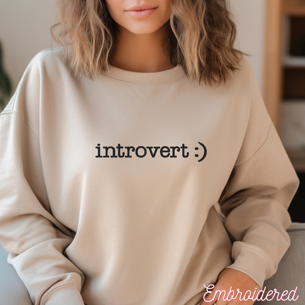 Stone crewneck fleece lined sweater with introvert :) embroidered on the front.