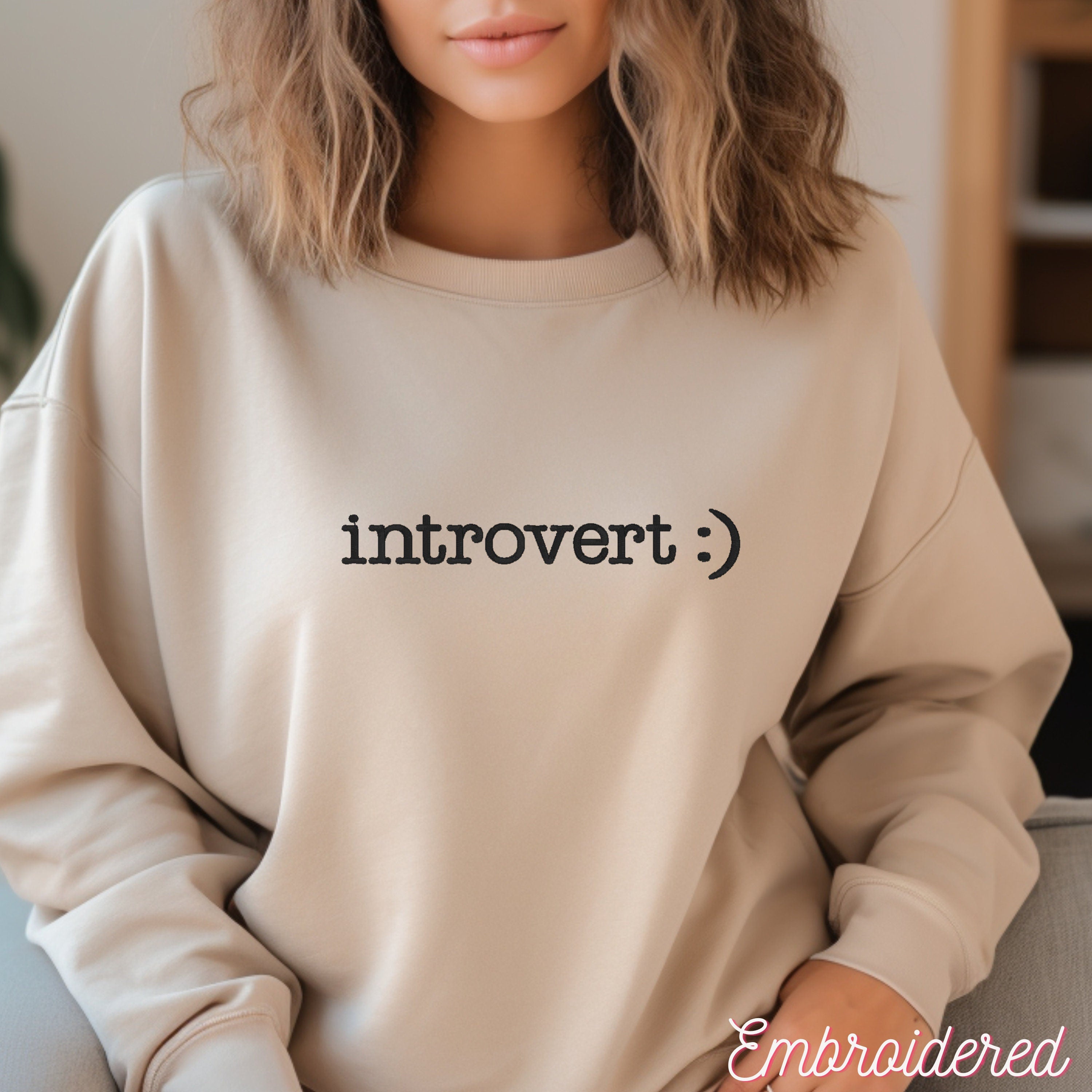 Stone crewneck fleece lined sweater with introvert :) embroidered on the front.