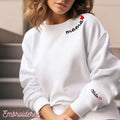 White crewneck fleece lined sweatshirt with mama and a heart embroidered on neckline. Embroider child's/children names on sleeve.
