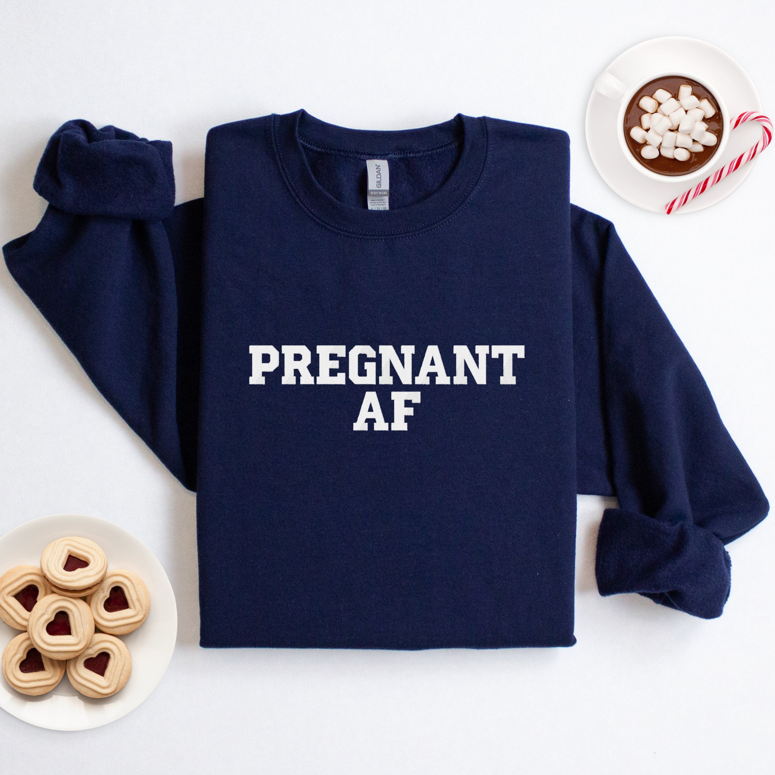 Navy Blue crewneck funny sweatshirt. With the words &quot;PREGNANT AF&quot; embroidered with white thread on the front.
