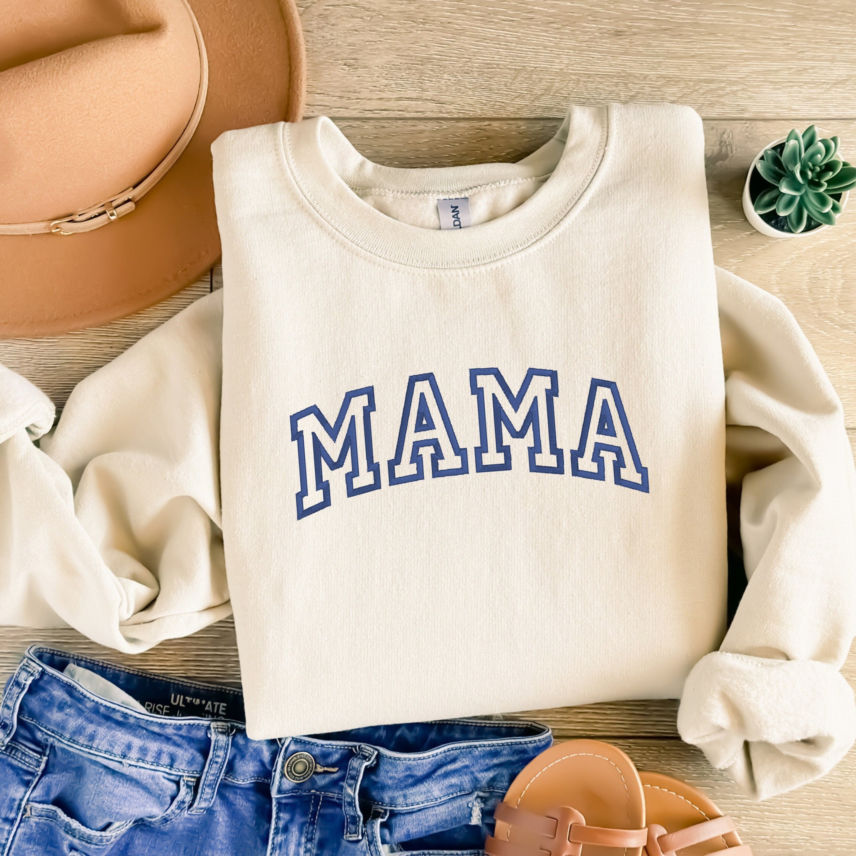 Stone sweater with MAMA embroidered on the front with flag blue thread.