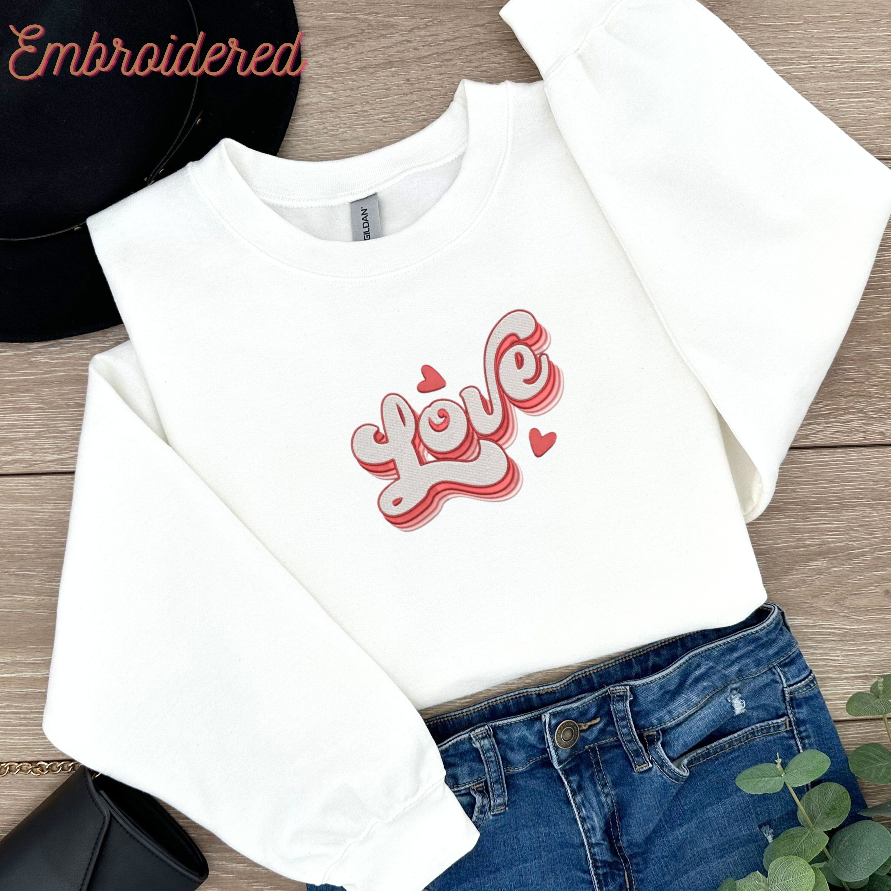 Valentine Embroidered Sweatshirt. Retro Love embroidered onto a white cozy sweatshirt front.
