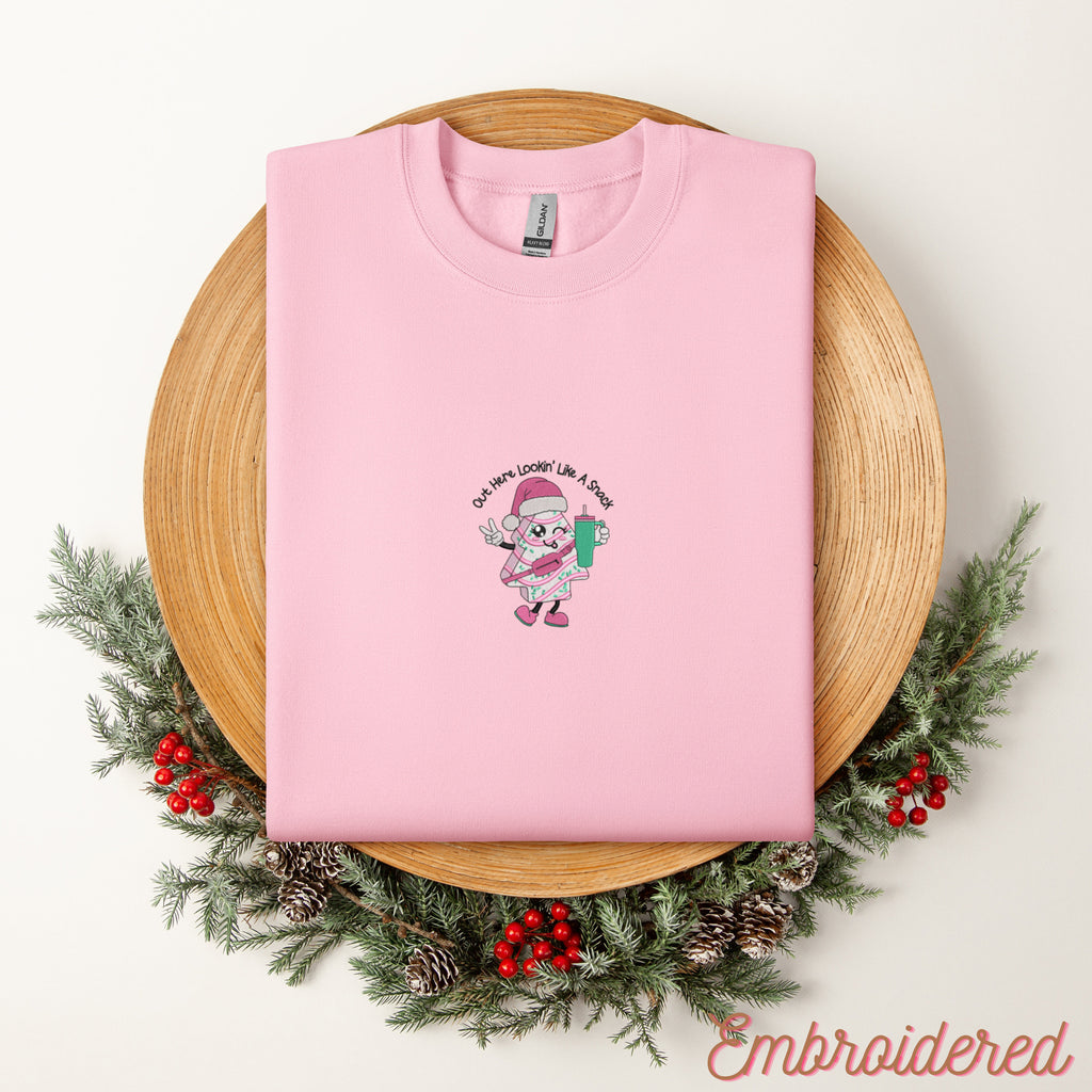 Lout Here Lookin Like a Snack Christmas Tree with Stanley Cup embroidered onto a light pink fleece lined crewneck sweatshirt.