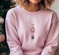 Pink Crewneck Cozy Fleece Sweatshirt embroidered with a cute pink Nutcracker on the front.
